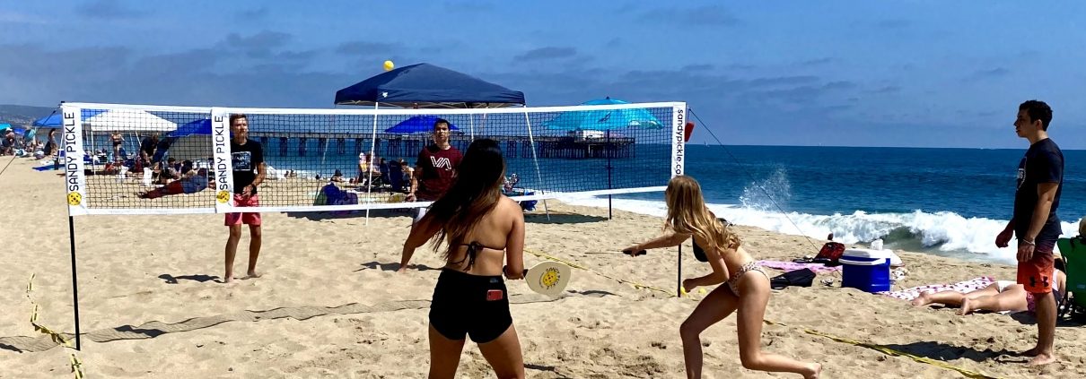 pickleball played on sand at the beach